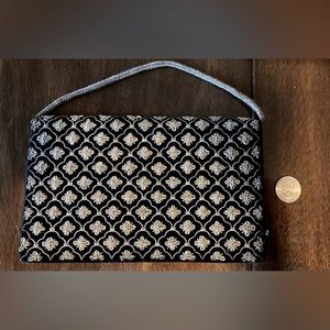 1970s, black velvet clutch with embroidered silver metallic threadsbraided strap
